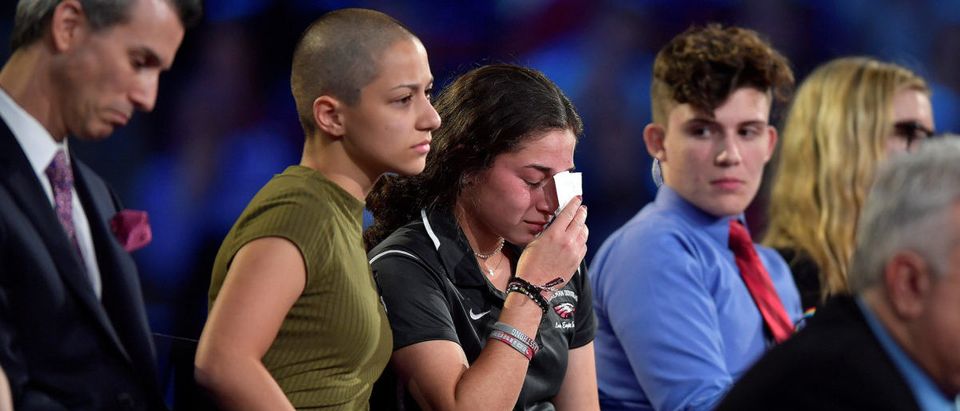 Marjory Stoneman Douglas High School student Emma Gonzalez comforts a classmate during a CNN town hall meeting, at the BB&amp;T Center, in Sunrise