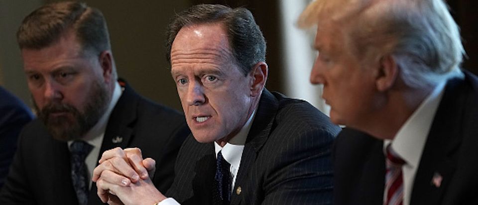 WASHINGTON, DC - FEBRUARY 13: U.S. Sen. Pat Toomey (R-PA) (2nd L) speaks as President Donald Trump (R) listens during a meeting with congressional members in the Cabinet Room of the White House February 13, 2018 in Washington, DC. President Trump held a meeting with congressional members to discuss trade. (Photo by Alex Wong/Getty Images)