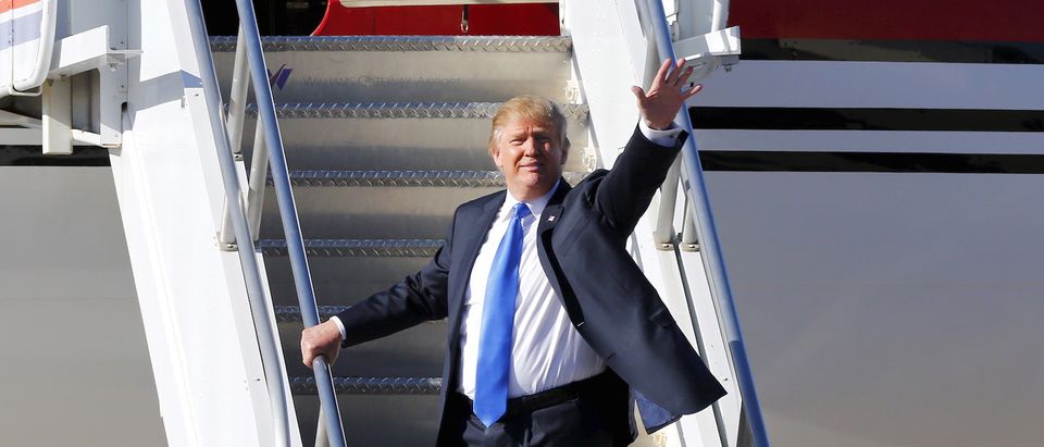 Republican presidential candidate Donald Trump boards his plane after speaking at a campaign rally in Mesa, Arizona