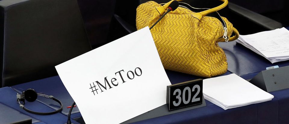 A placard with the hashtag "MeToo" is seen on a European Parliament member's desk during a debate to discuss preventive measures against sexual harassment and abuse in the EU at the European Parliament in Strasbourg, France, October 25, 2017. REUTERS/Christian Hartmann -