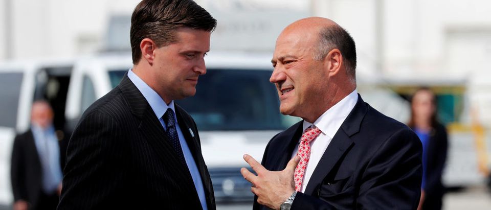 White House chief economic adviser Gary Cohn (R) talks with White House Staff Secretary Rob Porter (L) as they arrive with U.S. President Donald Trump aboard Air Force One at Indianapolis International Airport in Indianapolis, Indiana, U.S. September 27, 2017. REUTERS/Jonathan Ernst