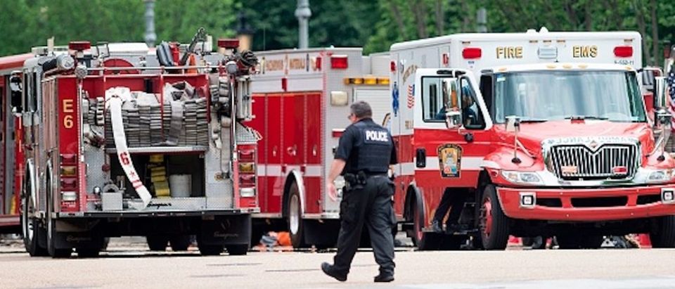 A member of the Secret Service walks past firetrucks and ambulances on Pennsylvania Avenue during a security lockdown of the White House grounds May 30, 2016 in Washington, DC. / AFP PHOTO / Brendan Smialowski (Photo credit should read BRENDAN SMIALOWSKI/AFP/Getty Images) | DC Elementary Kids Hospital Overdose