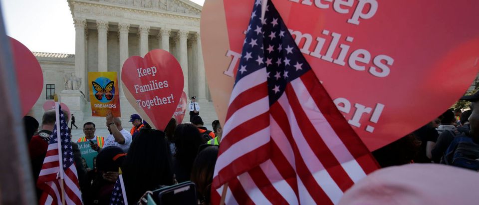 Immigration activists rally outside the U.S. Supreme Court as justices hear arguments in a challenge by 26 states over the constitutionality of President Barack Obama's executive action to defer deportation of certain immigrant children and parents who are in the country illegally in Washington April 18, 2016. REUTERS/Joshua Roberts