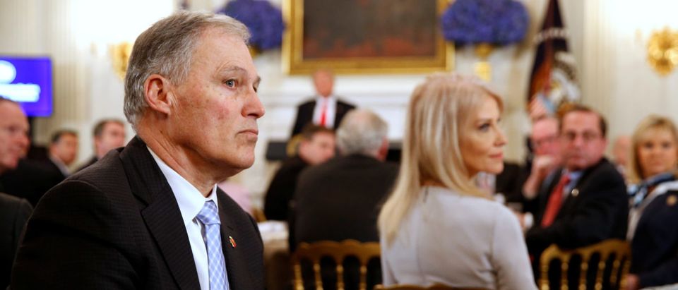 Washington State Governor Jay Inslee (L) listens to participants as U.S. President Donald Trump holds a discussion about school shootings with state governors from around the country at the White House in Washington, U.S. February 26, 2018. REUTERS/Jonathan Ernst | Cowlitz Co. Joins Suit Against Washington