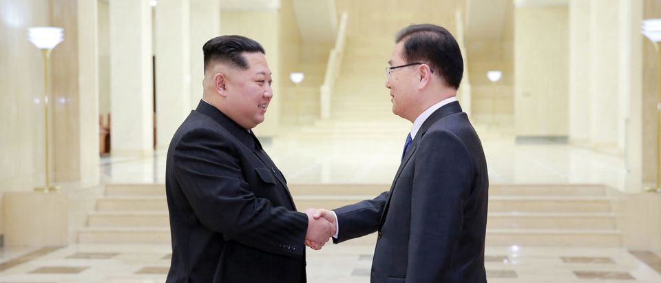 North Korean leader Kim Jong Un shakes hands with Chung Eui-yong
