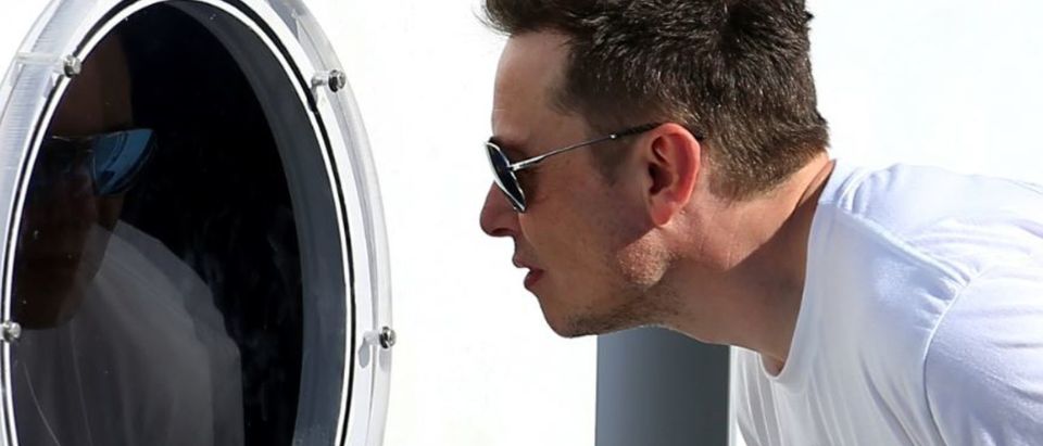 Elon Musk, founder, CEO and lead designer at SpaceX and co-founder of Tesla, checks out the SpaceX Hyperloop Pod Competition II in Hawthorne, California, U.S., August 27, 2017. REUTERS/Mike Blake | Analysts Brutalize Cash-Strapped Tesla
