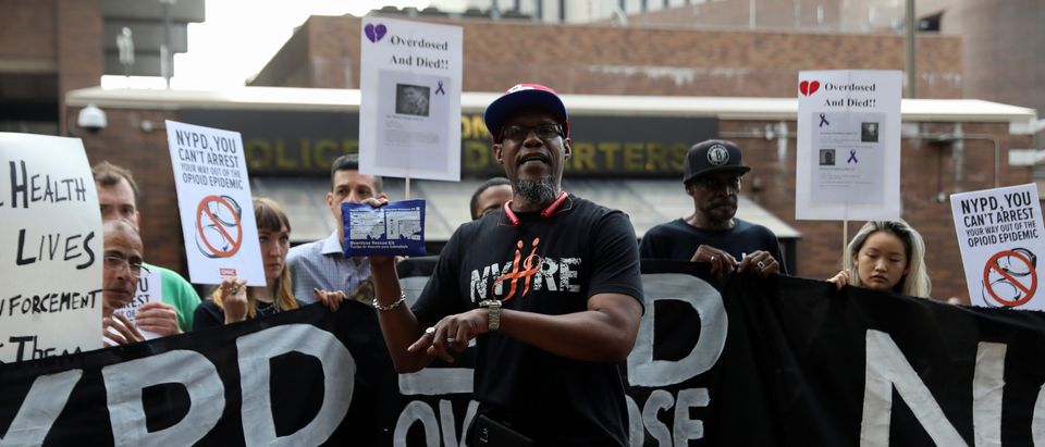 Levele Pointer, from the group Vocal New York, holds up a naloxone (NARCAN) overdose kit while speaking during an overdose crisis rally outside of the NYPD headquarters in New York, U.S., August 10, 2017. REUTERS/Shannon Stapleton -