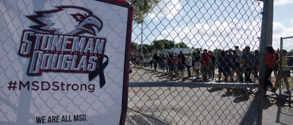 Students and parents arrive for campus orientation at Marjory Stoneman Douglas High in Parkland