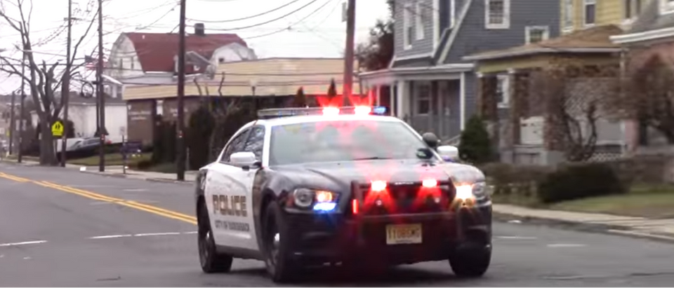 A police car responds to an emergency. (Photo Credit: YouTube/Demonracer2)