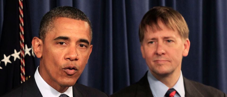U.S. President Barack Obama speaks as Richard Cordray (R), his appointed head of the Consumer Financial Protection Bureau (CFPB), stands at his side during Obama's visit to the CFPB in Washington January 6, 2012. Cordray ordered staff back into the building while construction was underway | 'Fumes' Sicken CFPB Employees | REUTERS/Kevin Lamarque (UNITED STATES - Tags: BUSINESS POLITICS)