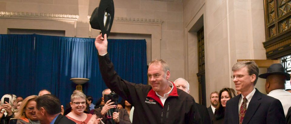 New Interior Secretary Ryan Zinke tipping his cowboy hat after riding in on horseback with a U.S. Park Police horse mounted unit reporting for his first day of work at the Interior Department in Washington
