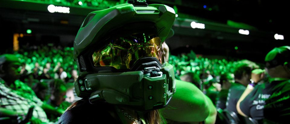 An attendee wearing a Halo Master Chief helmet waits for the Microsoft Xbox E3 2017 media briefing in Los Angeles, California, U.S., June 11, 2017. REUTERS/Kevork Djansezian