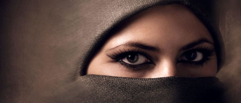 Muslim Woman Wearing A Hijab (shutterstock/ Ihor Voloshyn) | Muslim Parents Beat, Pour Oil On Daughter