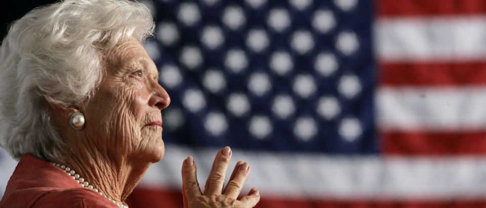 FILE PHOTO: Former U.S. first lady Barbara Bush listens to her son, President George W. Bush, as he speaks at an event on social security reform in Orlando, Florida March 18, 2005. REUTERS/Jason Reed/File Photo
