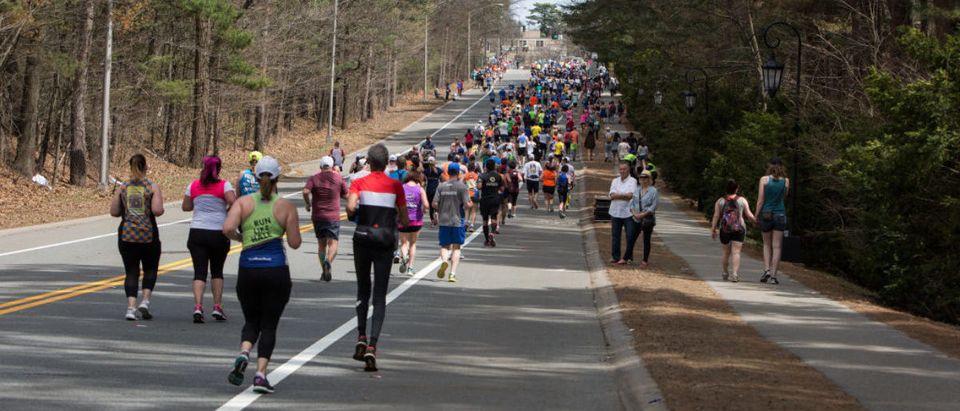 Crowds Gather Along Route of Boston Marathon To Cheer On Runners