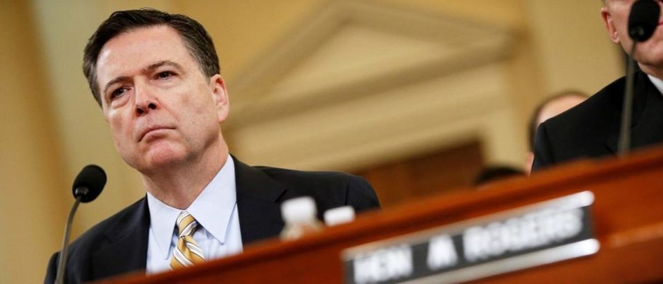 FILE PHOTO: Then-FBI Director James Comey testifies before the House Intelligence Committee hearing into alleged Russian meddling in the 2016 U.S. election, on Capitol Hill in Washington, U.S., March 20, 2017. REUTERS/Joshua Roberts/File Photo | Comey Shared Classified Memos With Friend