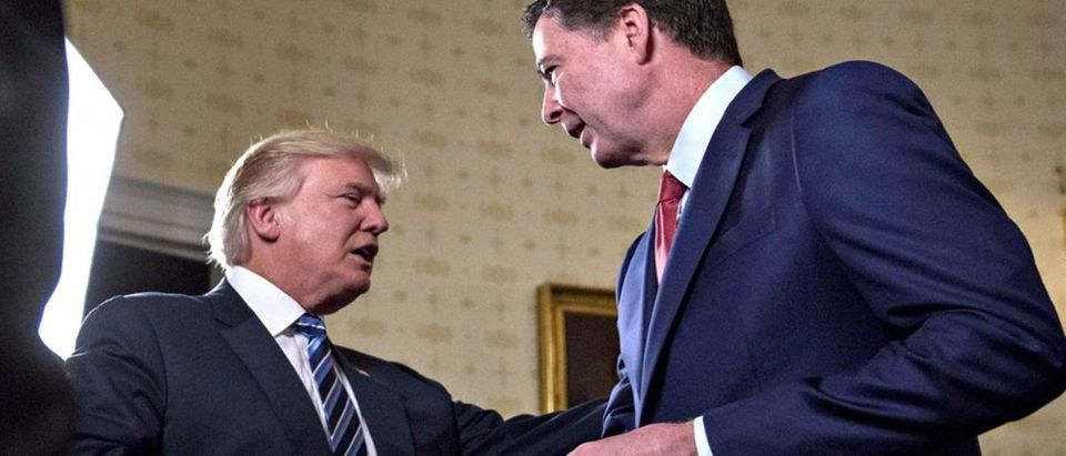 President Donald Trump shakes hands with James Comey, then the director of the FBI, in the Blue Room of the White House in January 2017.Andrew Harrer / Bloomberg via Getty Images | Comey Memo: CNN Prompted Dossier Briefing