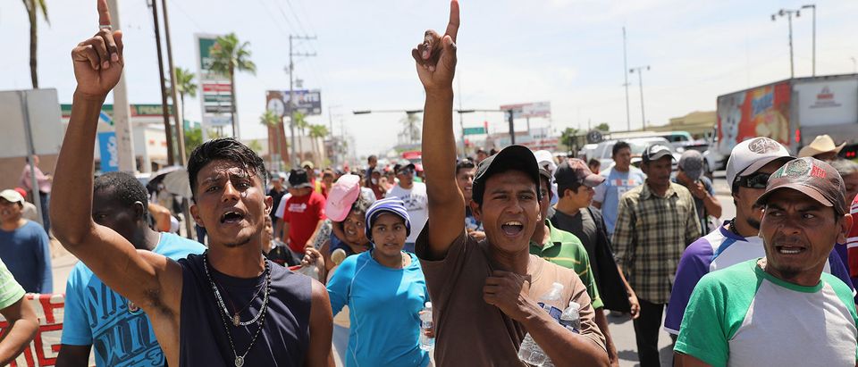 Central American immigrants, part of an immigrant "caravan," march in protest against U.S. President Donald Trump on April 23, 2018 in Hermosillo, Mexico. They demonstrated against Trump's morning tweets calling for U.S. Homeland Security to stop them from crossing the border into the United States to request political asylum. More than 500 immigrants, the remnants of a caravan of Central Americans that began their journey north almost a month ago, is within days of reaching their destination in Tijuana, which borders San Diego. Traveling together, many atop freight trains known as the "beast," or in buses, they have sought safety in numbers on the dangerous journey. Along the way, they have received an outpouring of help from local charities, the Mexican Red Cross, private citizens and government officials. President Trump sent National Guard troops to U.S. border regions in response to the caravan weeks before, although many in the group are families who plan to seek political asylum the U.S. (Photo by John Moore/Getty Images) | Nielsen Reprimanding 'Caravan' Illegals