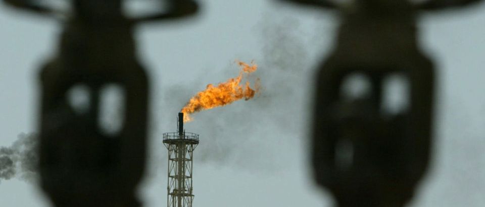 A tower at the Basra South oil refinery in the southern Iraq city of Basra flares as it cooks off excess natural gas, May 20, 2004. Oil prices rose on Thursday, closing the gap to this week's 21-year peak, after data on the health of U.S. fuel stocks failed to stem worries of a possible gasoline supply crunch during peak summer holiday demand. NTRES REUTERS/Zohra Bensemra CLH/DL | Enviros Sue Trump For Reviewing Obama Reg
