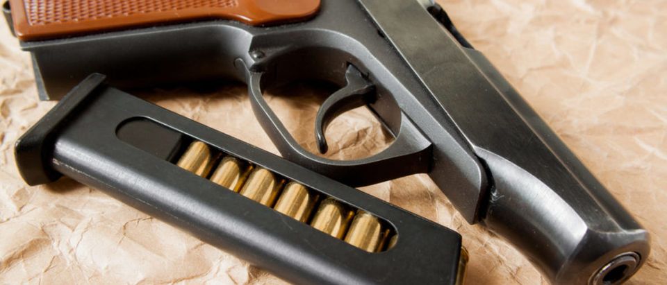 Here's a pistol with ammo. (Shutterstock/Aleksey Kuzmenko)