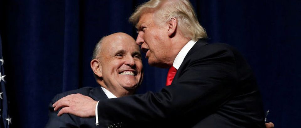 Republican presidential nominee Donald Trump embraces former New York City Mayor Rudolf Giuliani at a campaign rally in Greenville, North Carolina, U.S., September 6, 2016. REUTERS/Mike Segar