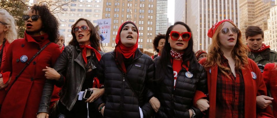 Organizers Linda Sarsour (C), Carmen Perez (2nd R) and Bob Bland (R) lead during a 'Day Without a Woman' march on International Women's Day in New York, U.S., March 8, 2017. REUTERS/Lucas Jackson | Backpage.com Admits To Human Trafficking