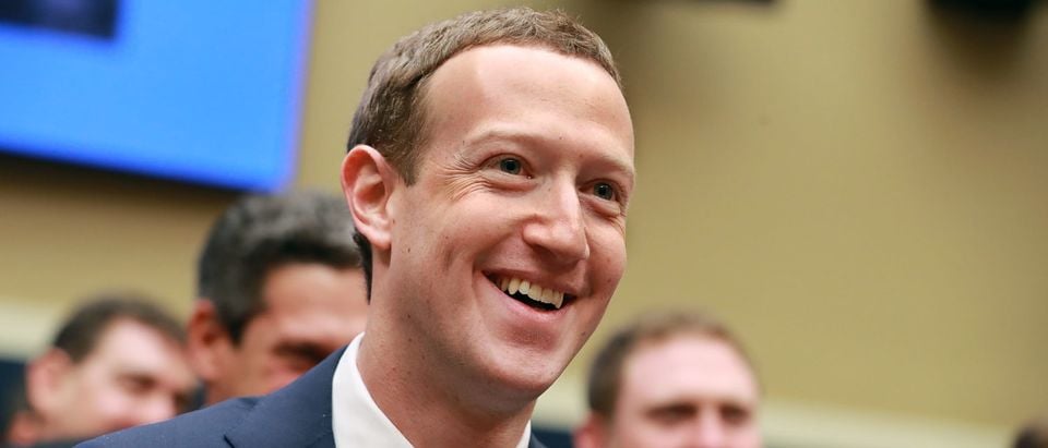 WASHINGTON, DC - APRIL 11: Facebook co-founder, Chairman and CEO Mark Zuckerberg smiles at the conclusion of his testimony before the House Energy and Commerce Committee in the Rayburn House Office Building on Capitol Hill April 11, 2018 in Washington, DC. This is the second day of testimony before Congress by Zuckerberg, 33, after it was reported that 87 million Facebook users had their personal information harvested by Cambridge Analytica, a British political consulting firm linked to the Trump campaign. (Photo by Chip Somodevilla/Getty Images)