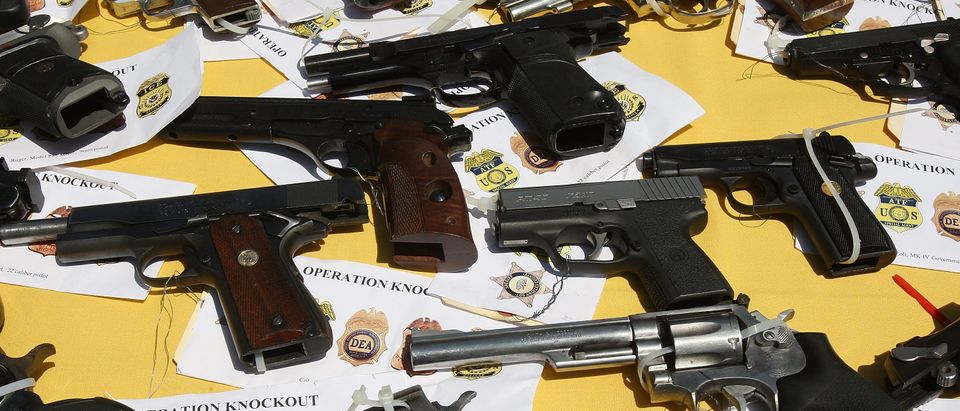 LAKEWOOD, CA - MAY 21: Some of about 125 weapons confiscated during what the federal authorities say is the largest gang takedown in United States history are displayed at a press conference to announce the arrests of scores of alleged gang members and associates on federal racketeering and drug-trafficking charges on May 21, 2009 in the Los Angeles-area community of Lakewood, California. 147 people were indicted in the case involving racially motivated attacks on African-Americans and law enforcement officers. Operation Knockout is the latest of several investigations that found gangs engaged in race-based violence. Two years ago, a Latino gang was charged with waging a violent campaign to drive blacks out of a Los Angeles-area neighborhood that resulted in 20 homicides. Last year, another Latino gang was accused of targeting blacks and killing 14-year-old Cheryl Green, whose death became a community rallying point. In 2006, Avenues gang members Latinos were convicted of assaults and killings of blacks in the 1990s. (Photo by David McNew/Getty Images)