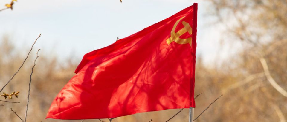 Featured is the red, sickle-hammer banner of the Soviet Union. (Shutterstock/kzww)