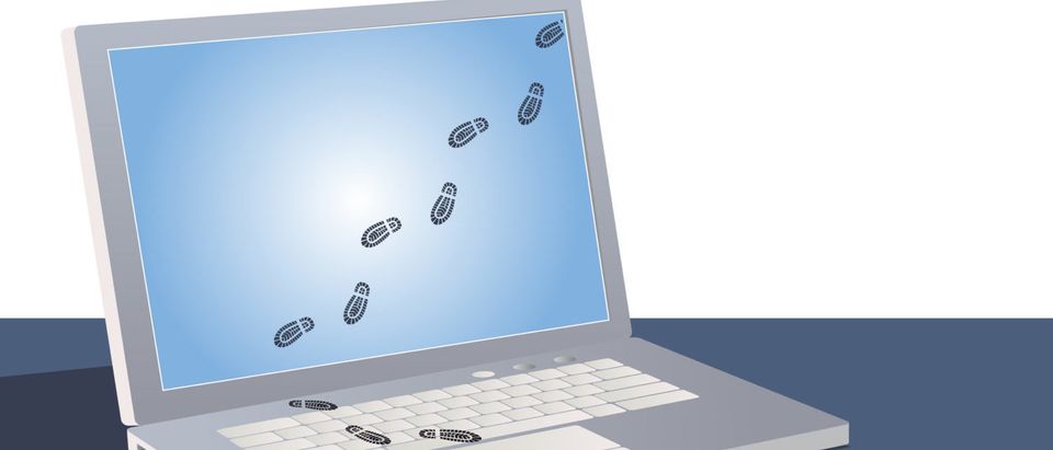 Digital footprints crossing a laptop screen. [Shutterstock - Aleutie] | Facebook Telling Users Of Tracking Sites
