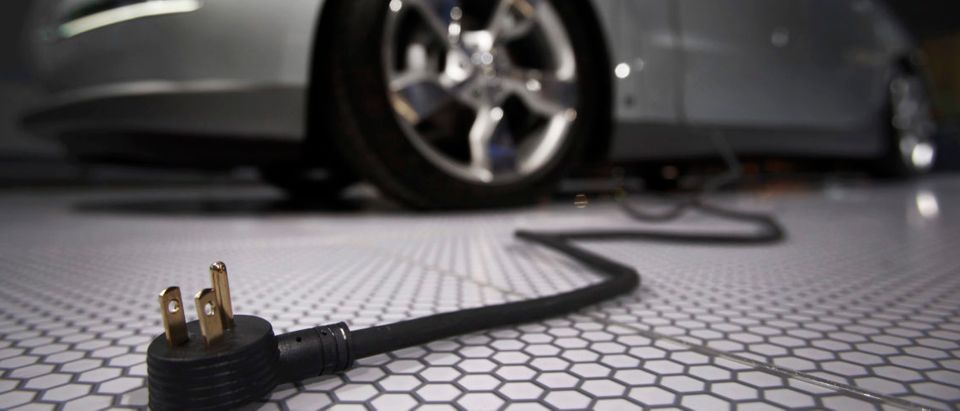 A plug is seen coming from the Chevrolet Volt electric car during the North American International Auto Show in Detroit, Michigan January 13, 2009. REUTERS/Mark Blinch | Poor People Don't Own Electric Vehicles