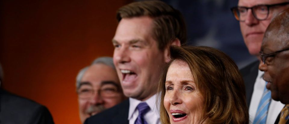 U.S. House Minority Leader Nancy Pelosi (D-CA) (R), flanked by Representative Steny Hoyer (D-MD) (L) and Representative Eric Swalwell (D-CA) (2nd L), laughs during a news conference with Democratic leaders on the Republicans' attempt to repeal the Obamacare health care legislation at the U.S. Capitol in Washington, U.S., March 24, 2017. REUTERS/Jonathan Ernst
