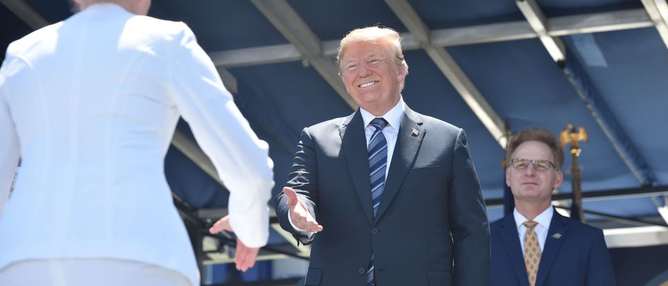 President Donald Trump greets graduating midshipmen on May 25, 2018, during the graduation ceremony at the US Naval Academy in Annapolis, Maryland. (Photo: NICHOLAS KAMM/AFP/Getty Images)