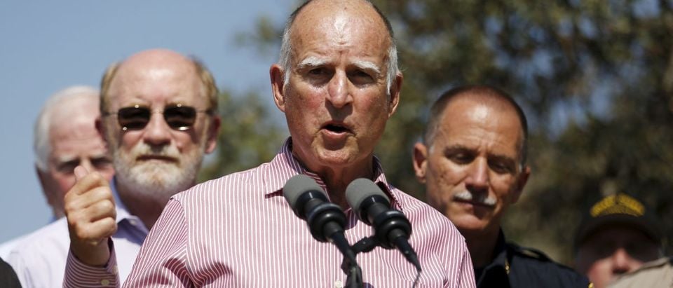 California Governor Jerry Brown speaks at a news conference after meeting with displaced residents and first responders from the Rocky Fire at Cowboy Camp Trailhead near Clearlake, California August 6, 2015. The battle to tame California's fiercest wildfire this year, the big Rocky blaze north of Napa Valley wine country, neared a turning point on Thursday as ground crews fighting the flames for an eighth day steadily extended their control lines. REUTERS/Stephen Lam