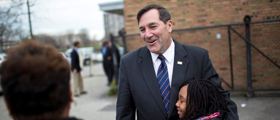 FILE PHOTO: U.S. Rep. Joe Donnelly (D-IN) campaigns at a polling place in Indianapolis