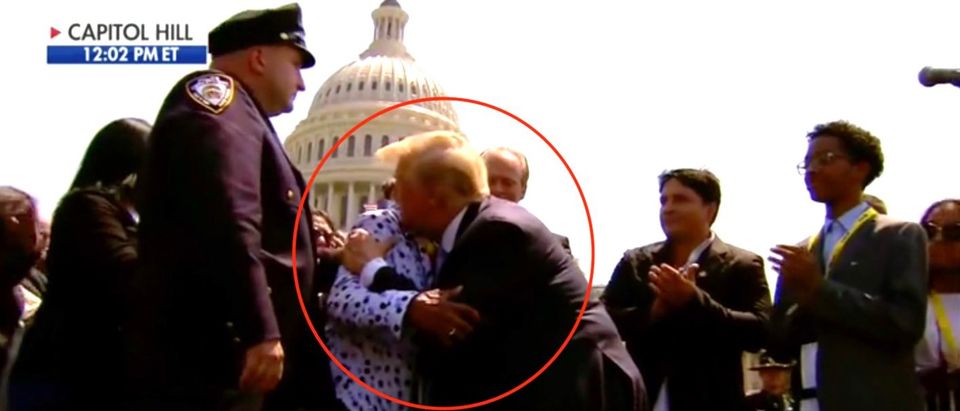 Trump embraces woman during police event (Fox News)