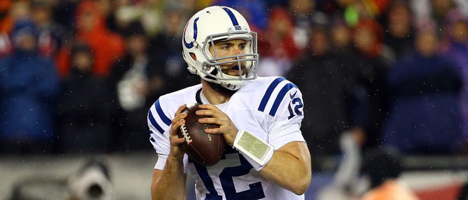 FOXBORO, MA - JANUARY 18: Andrew Luck #12 of the Indianapolis Colts looks to throw a pass during the first quarter against the New England Patriots in the 2015 AFC Championship Game at Gillette Stadium on January 18, 2015 in Foxboro, Massachusetts. (Photo by Al Bello/Getty Images)