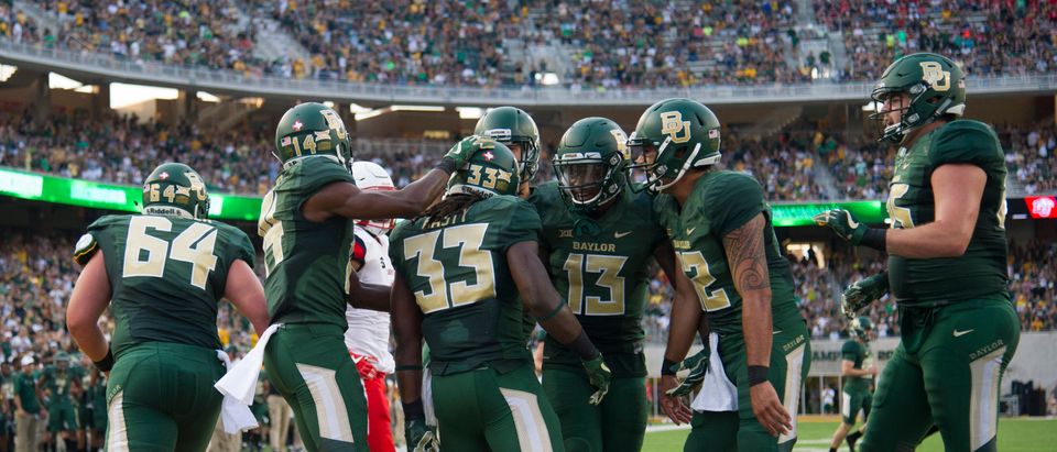 Jamychal Hasty #33 of the Baylor Bears celebrates with teammates after a 13 yard touchdown run against the Liberty Flames during the first half at McLane Stadium on September 2, 2017 in Waco, Texas. (Photo by Cooper Neill/Getty Images)
