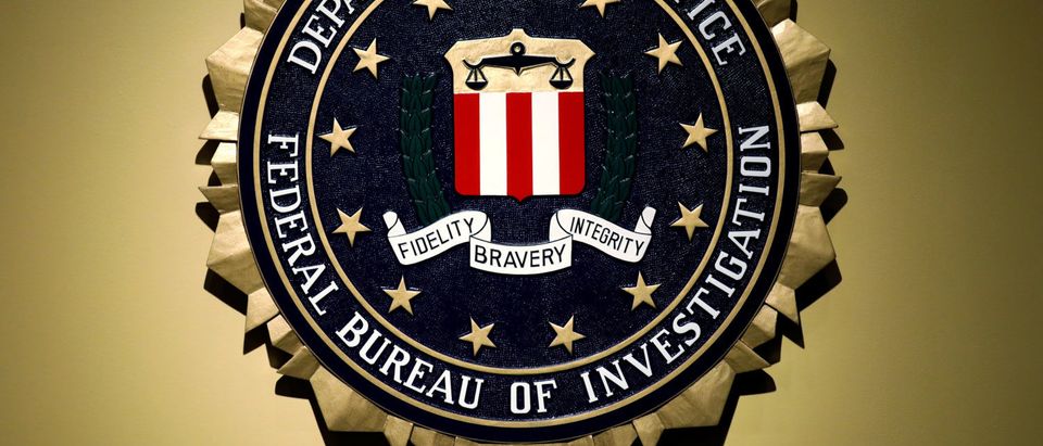 The Federal Bureau of Investigation seal is seen at FBI headquarters before a news conference by FBI Director Christopher Wray on the U.S Justice Department's inspector general's report regarding the actions of the Federal Bureau of Investigation and the 2016 U.S. presidential election in Washington, U.S. June 14, 2018. REUTERS/Yuri Gripas