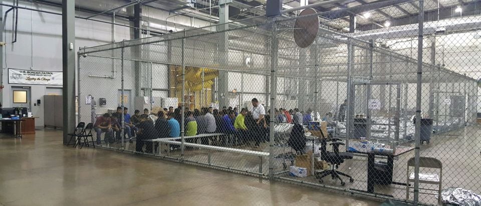 A view of inside CBP detention facility shows detainees inside fenced areas at Rio Grande Valley Centralized Processing Center in Texas