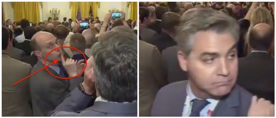 Jim Acosta gets "shushed" after yelling at President Trump. POLITICO Twitter video screenshots