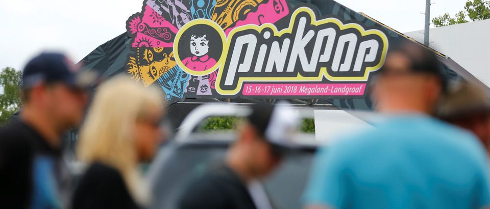 Visitors leave the festival grounds near a scene where a van struck into people after a concert at the Pinkpop festival in Landgraaf