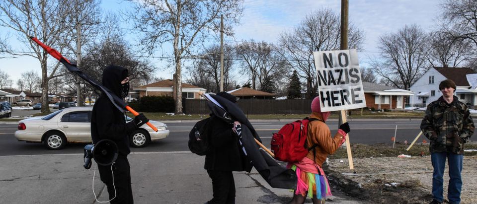 Members of the Great Lakes anti-fascist organization (Antifa) protest against the Alt-right outside a hotel in Warren, Michigan