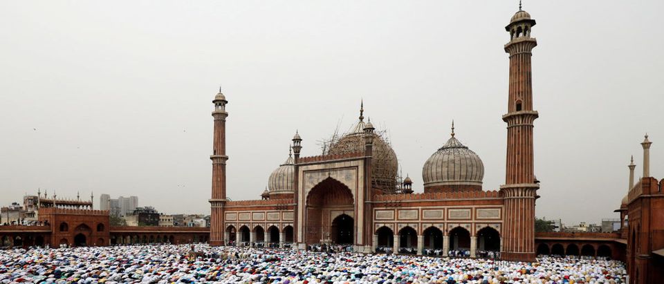 Men offer Eid al-Fitr prayers marking the end of the holy fasting month Ramadan at Jama Masjid (Grand Mosque) in the old quarters of Delhi