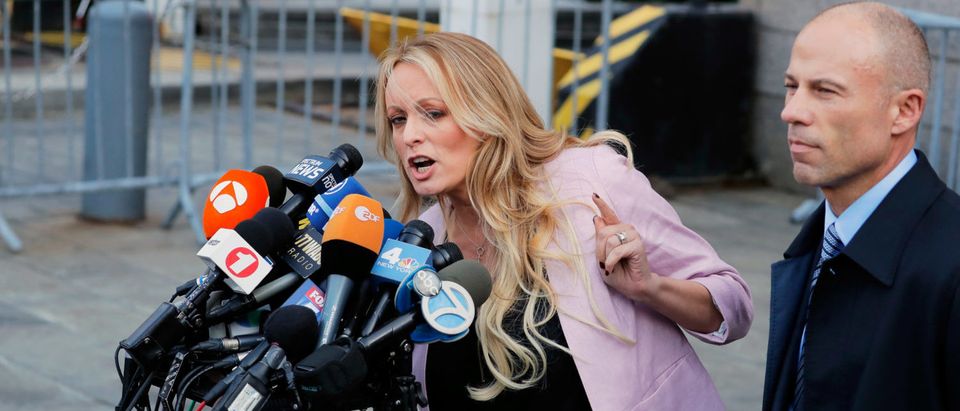 FILE PHOTO: Adult film actress Stephanie Clifford, also known as Stormy Daniels, speaks to media along with lawyer Michael Avenatti outside federal court in Manhattan