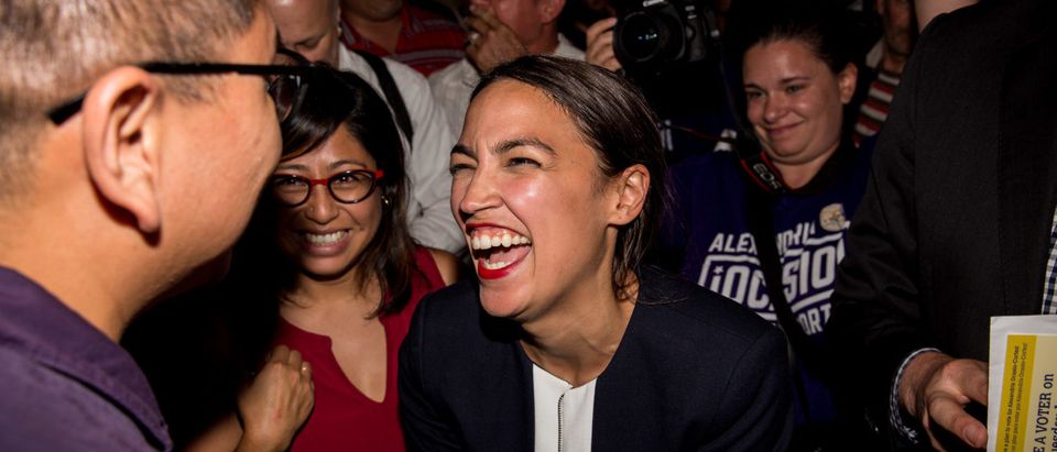NEW YORK, NY - JUNE 26: Progressive challenger Alexandria Ocasio-Cortez celebrartes with supporters at a victory party in the Bronx after upsetting incumbent Democratic Representative Joseph Crowly on June 26, 2018 in New York City. Ocasio-Cortez upset Rep. Joseph Crowley in New York’s 14th Congressional District, which includes parts of the Bronx and Queens. (Photo by Scott Heins/Getty Images)