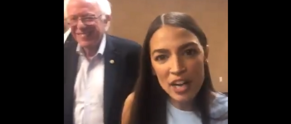 Alexandria Ocasio-Cortez appears with Bernie Sanders at Kansas rally (Twitter video screengrab)
