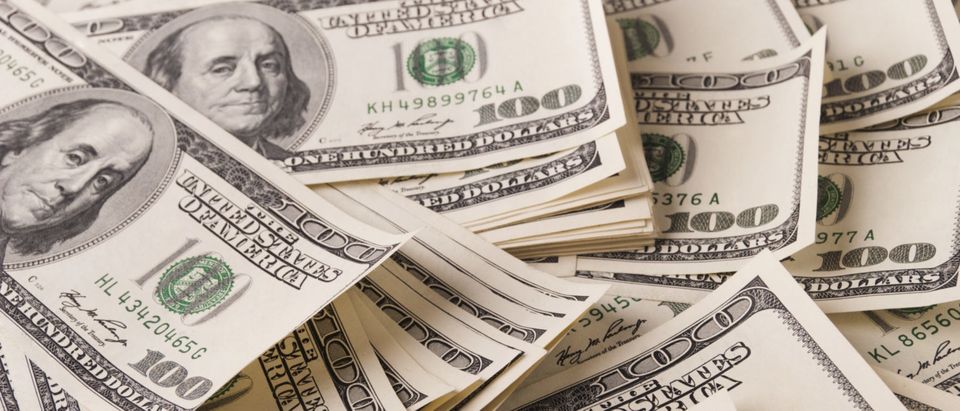 Bundles Of Cash (Shutterstock/ ElenaR)