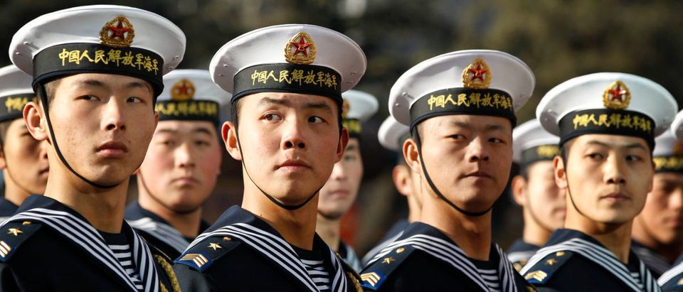 Members of the Chinese Navy's honor guard wait for U.S. Secretary of Defense Robert Gates to review military troops at Bayi Building in Beijing January 10, 2011. REUTERS/Larry Downing