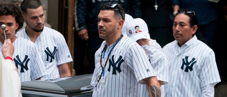 The body of of Lesandro Guzman-Feliz is taken from the Our Lady of Mount Carmel church after funeral services on June 27, 2018 in New York. - Lesandro Guzman-Feliz, 15, was stabbed to death outside a Bronx bodega in an apparent case of mistaken identity. DON EMMERT/AFP/Getty Images